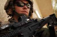 U.S. Army Spc. Rebecca Buck, a medic from Headquarters and Headquarters Company, 1st Battalion, 14th Infantry Regiment, 2nd Stryker Brigade Combat Team, 25th Infantry Division, provides perimeter security outside an Iraqi police station in the Tarmiya Province of Iraq, March 30, 2008.